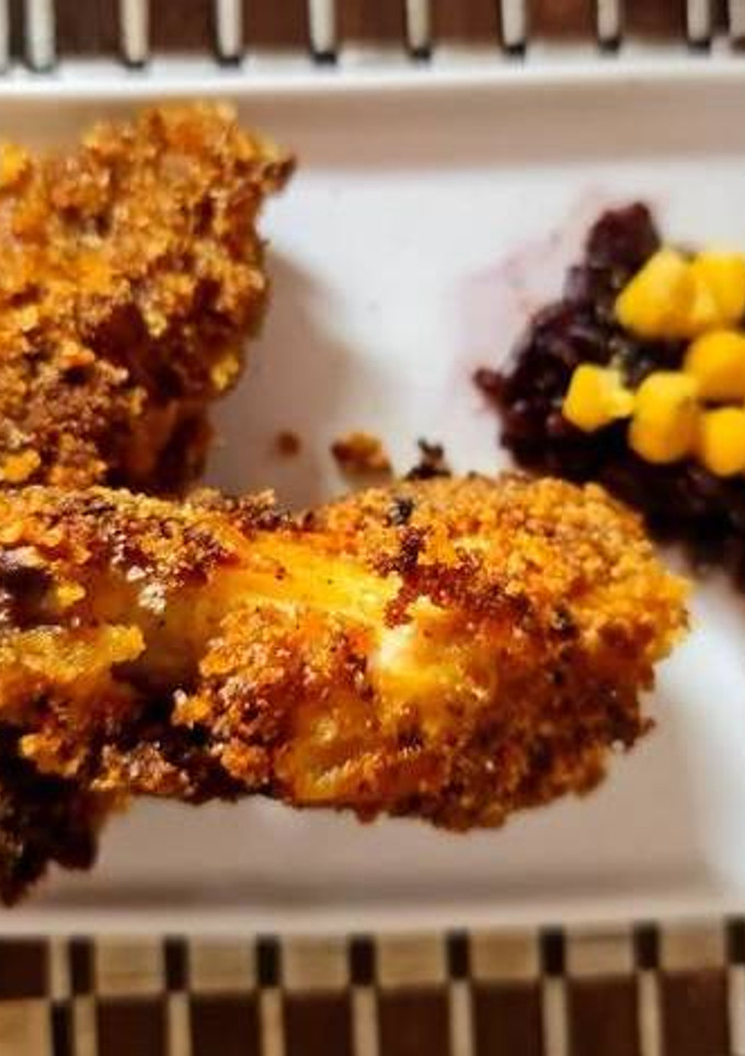 Una foto de Pollo Kentucky con arroz negro
