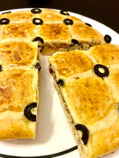 A picture of Focaccia with stuffed chicken.
