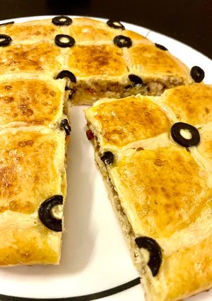 A picture of Focaccia with stuffed chicken.