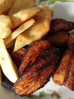 A picture of Fried fresh Potatoes and ripe plantain.