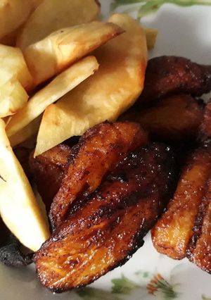 A picture of Fried fresh Potatoes and ripe plantain.