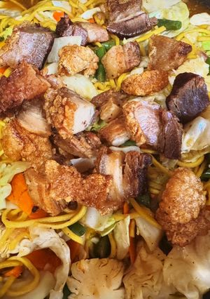 A picture of Pancit Canton w/Crispy Pork Belly.