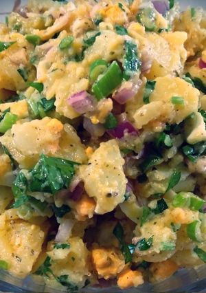 A picture of Potato Salad with Easter Eggs, Mustard, and Olives 🥔.