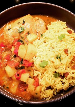 A picture of Cape Malay Chicken Curry with Yellow Rice.
