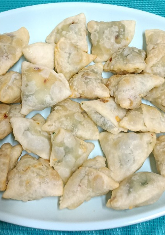 A picture of Pop In The Mouth ----- Mini Spinach & Cheese Samosas with home-made spring roll wrapper.