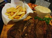 A picture of steak and chips