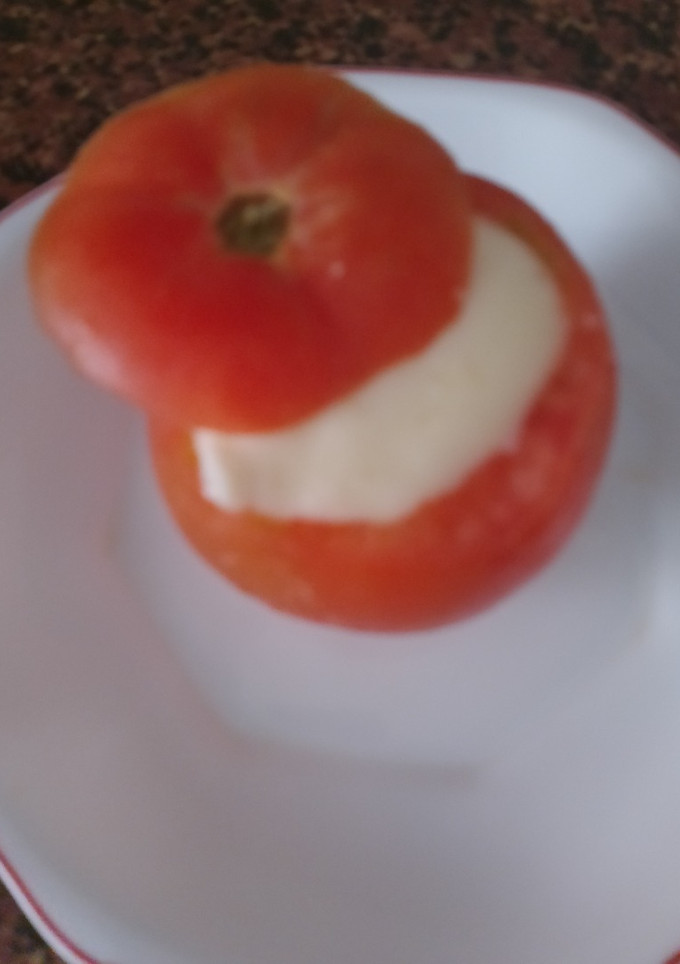 Una foto de Tomate relleno estilo fondue