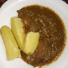A picture of Chicken sauce and boiled bananas #favorite Easter dish.
