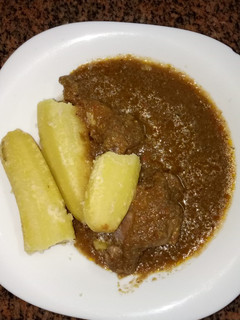 A picture of Chicken sauce and boiled bananas #favorite Easter dish.