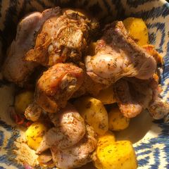 A picture of Grilled chicken and potatoes.