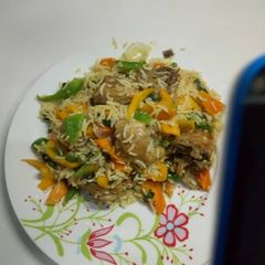 A picture of Chicken fried rice.
