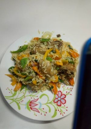A picture of Chicken fried rice.