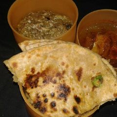 A picture of Sattu stuffed paratha with baingan bharta.