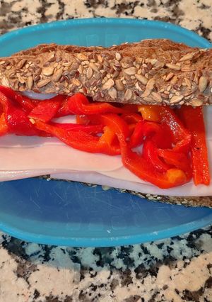 A picture of Seven-Grain Bread Sandwich with Turkey Breast and Peppers.