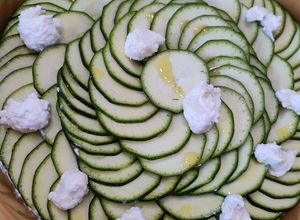 Une photo de Tian de Courgettes ricotta/menthe/parmesan