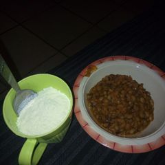 A picture of Beans and cassava flakes with milk #Abuja.
