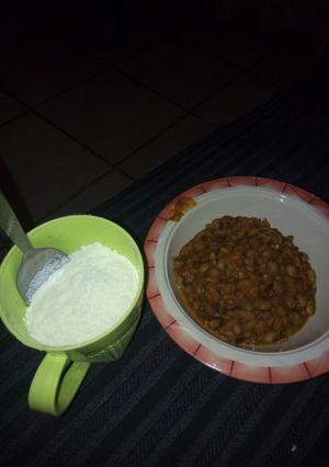 A picture of Beans and cassava flakes with milk #Abuja.