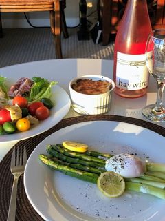 A picture of Asparagus with poached egg.