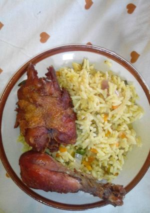 A picture of Fried rice and chicken.