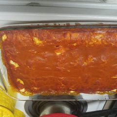A picture of Spinach chicken and onion enchiladas.