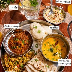 A picture of South Indian Fusion Thali with Chicken Curry & Sweet Kheer Delight.