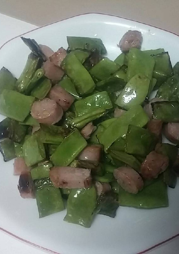 Una foto de Alubias verdes con sachichas