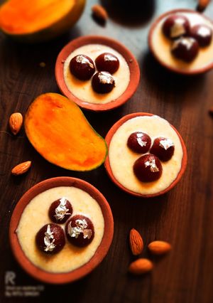 A picture of Gulab Jamun in Mango Rabdi.