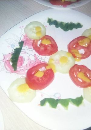 A picture of Cucumber and tomato salad.