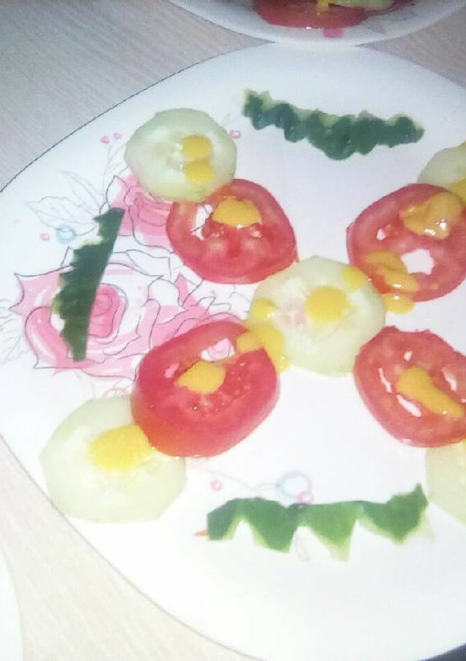 A picture of Cucumber and tomato salad.