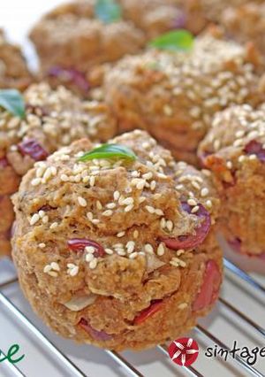 A picture of Muffins with olives.