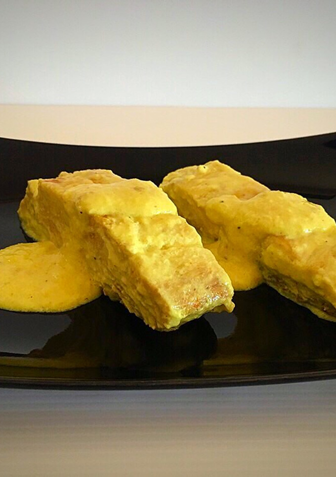 Una foto de Corvina en salsa de cúrcuma
