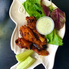 A picture of 3 Spice Tandoori Chicken drumsticks.