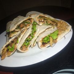 A picture of Chicken roti wraps.