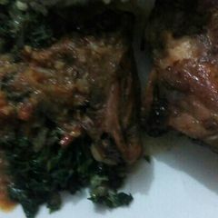 A picture of Ugali,chicken marinade with fried kales.