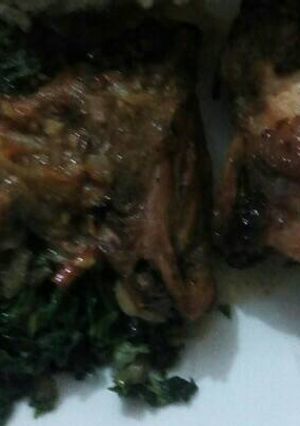 A picture of Ugali,chicken marinade with fried kales.