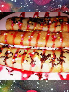 Una foto de Crepes con Nutella y sirope de fresa