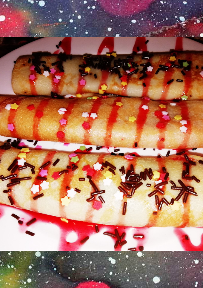Una foto de Crepes con Nutella y sirope de fresa