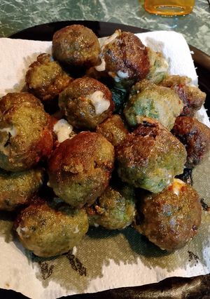 A picture of Beef Meatballs with Spinach and Fontina in Beer Sauce.