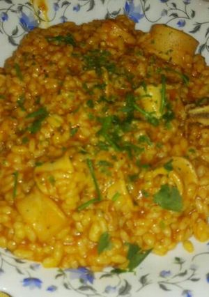 Una foto de Arroz con calamares y azafrán