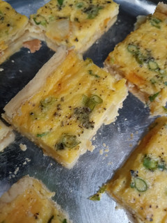 Una foto de Quiche cebollino y queso