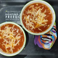 A picture of Tomato corn cheese soup.