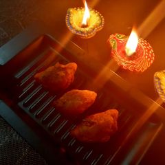 A picture of Ranga Aloor Puli Pithe/ Sweet Potato Dumplings.