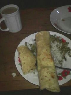 A picture of Ndengu and rice served with chapati.