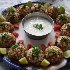 A picture of Sabudana appe with curd.