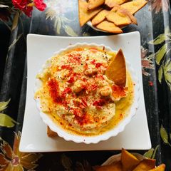 Nacho chips with hummus A picture of Nacho chips with hummus.