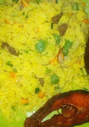 A picture of Fried rice with fried fresh tillapia.