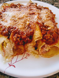 Una foto de Canelones de jamón, ricota y queso