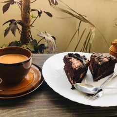 A picture of Chocolate brownie cake with tea ☕️.