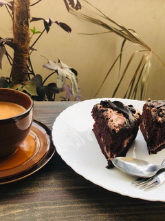 A picture of Chocolate brownie cake with tea ☕️.