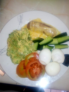 A picture of Boiled eggs with mashed avocado.